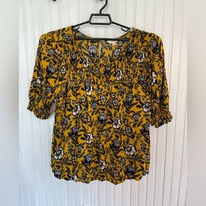 Gold and Navy short sleeve blouse. Floral print.